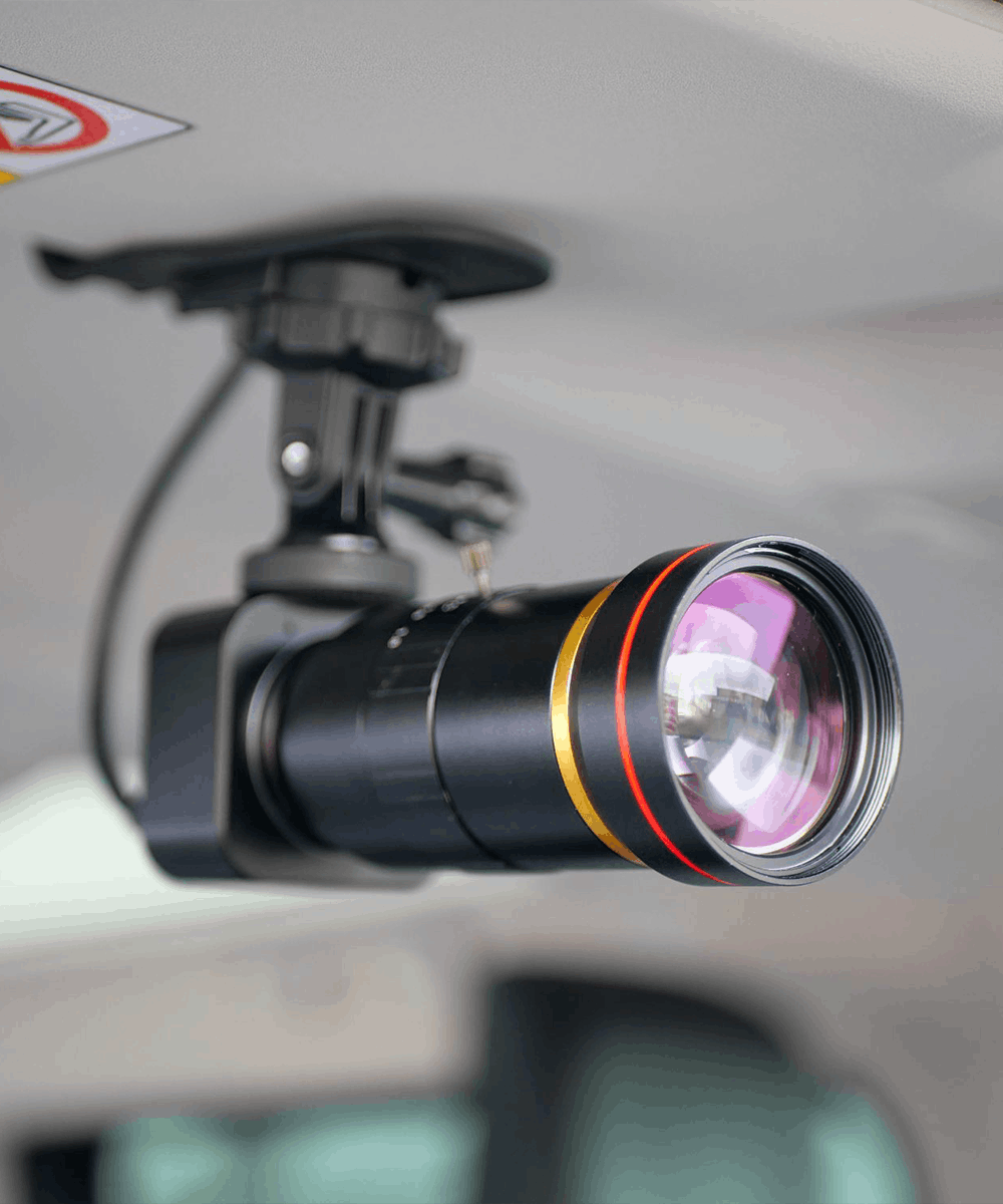 BlackCam 12-120mm zoom camera for BlackBox in a car with sun visor adapter