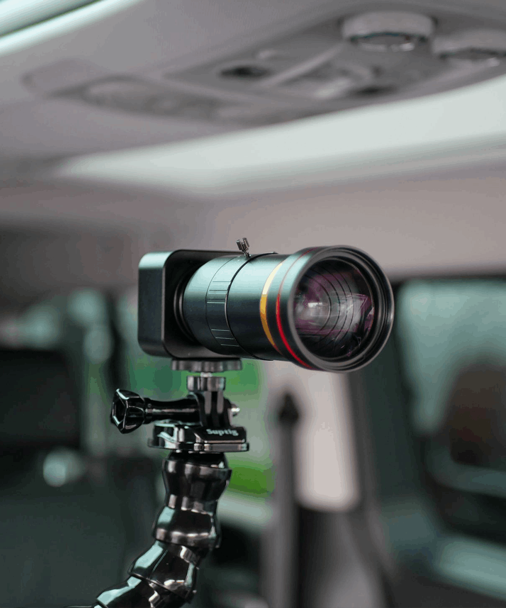 BlackCam 12-120mm zoom camera for BlackBox in a car with headrest mount